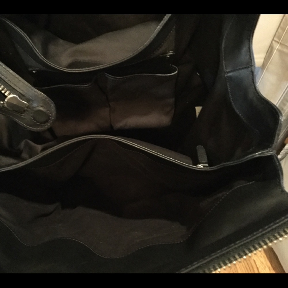 Aritzia’s Six Eleven black leather McDuffle - Picture 12 of 14